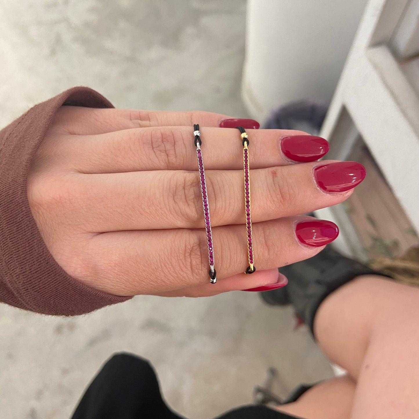 bracc filo nero barretta zirconi rossi