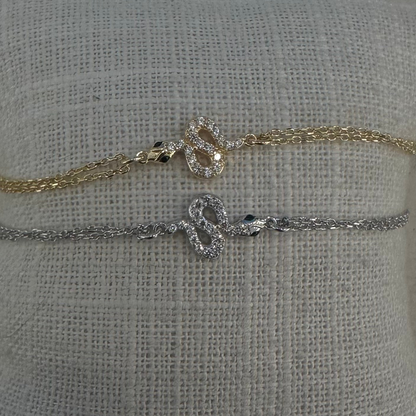 bracciale serpente con zirconi bianchi finitura argento e catena