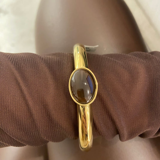 Bracciale Rigido Dorato con Pietra Marrone Centrale