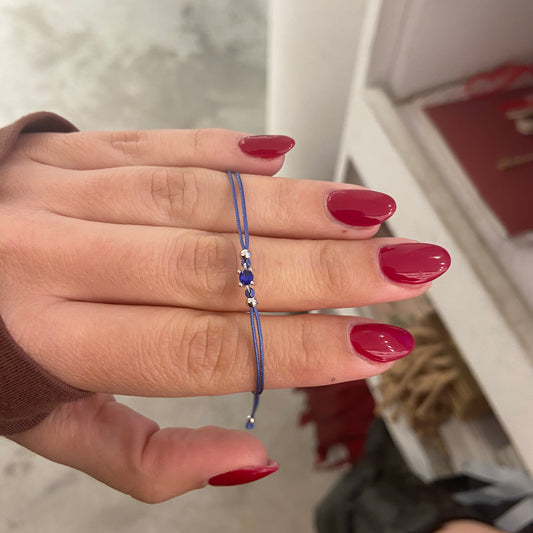 bracciale con punto luce di zircone blu e cordino blu